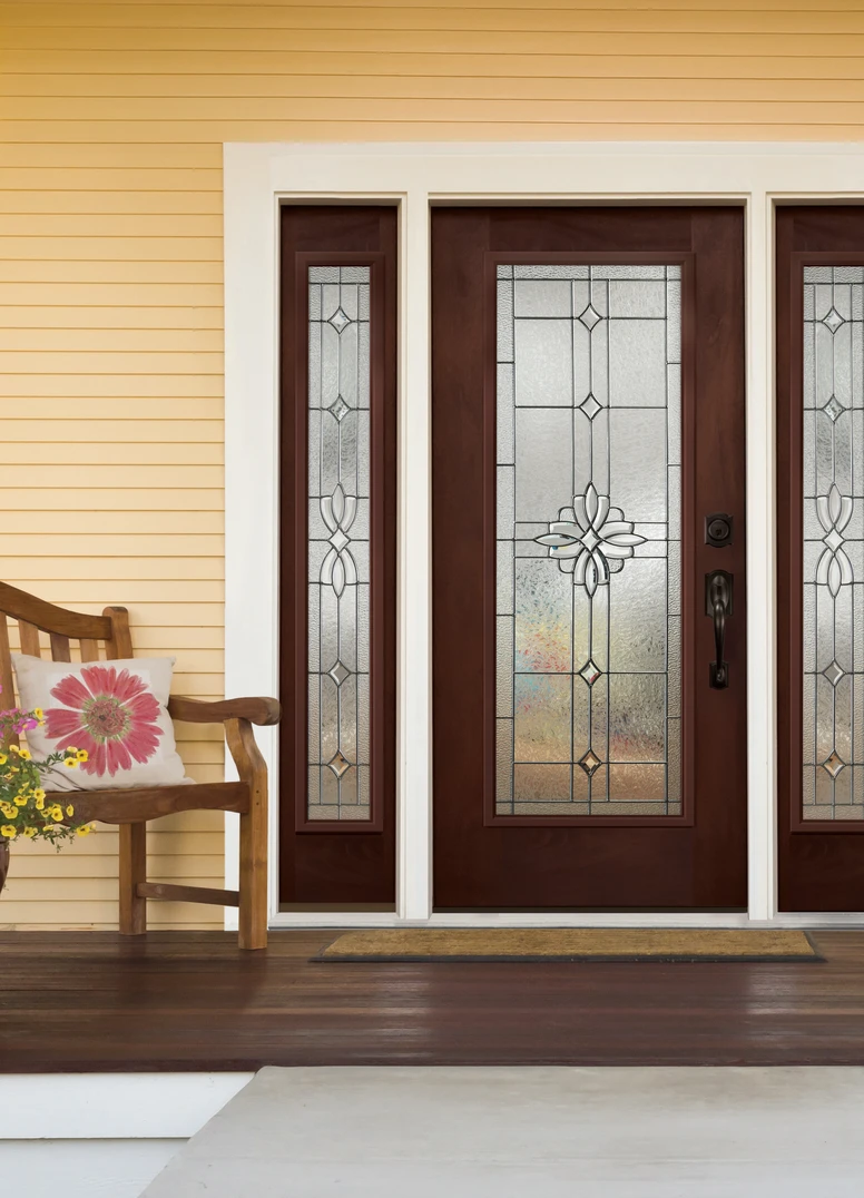 WOODGRAIN FULL LITE DOOR AND FULL LITE SIDELITES IN MOORISH TEAK WITH LAUREL GLASS. CAMELOT HANDLESET AND DEADBOLT IN AGED BRONZE. WOODGRAIN FULL LITE DOOR AND FULL LITE SIDELITES IN MOORISH TEAK WITH LAUREL GLASS. CAMELOT HANDLESET AND DEADBOLT IN AGED BRONZE.